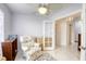 Cozy bedroom featuring a floral armchair and a view into the bright and airy hall at 40 Trailside Ct, Henderson, NV 89012