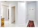Bright hallway with white walls, sleek marble floors, and access to multiple rooms at 40 Trailside Ct, Henderson, NV 89012
