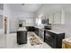 Bright kitchen featuring white upper cabinets, stainless steel appliances, and a kitchen island at 40 Trailside Ct, Henderson, NV 89012