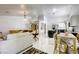 Bright and open floor plan connecting the living room, dining area, and kitchen with pristine marble flooring at 40 Trailside Ct, Henderson, NV 89012