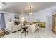Bright living room features marble flooring, neutral sofas, and a fireplace at 40 Trailside Ct, Henderson, NV 89012