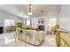 Well-lit living room featuring marble floors, a fireplace, neutral-toned furniture, and modern lighting fixtures at 40 Trailside Ct, Henderson, NV 89012