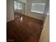 Bedroom featuring hardwood floors, closet with mirrored doors, and window at 4300 N Lamont St # 225, Las Vegas, NV 89115