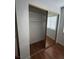 Bedroom closet with wood-look floors and mirrored doors at 4300 N Lamont St # 225, Las Vegas, NV 89115