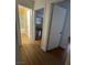 Open hallway view with wood-look flooring and multiple doors at 4300 N Lamont St # 225, Las Vegas, NV 89115