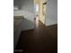 Hallway view with a laundry machine, cabinets, and wood-look flooring at 4300 N Lamont St # 225, Las Vegas, NV 89115