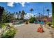 Expansive backyard with a pool, fire pit, lounge chairs and lush landscaping at 4617 Gonzales Dr, Las Vegas, NV 89130