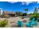 Well-maintained backyard featuring lounge chairs, a fire pit, desert landscaping, and refreshing pool at 4617 Gonzales Dr, Las Vegas, NV 89130