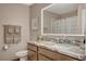 Tastefully updated bathroom features a marble countertop, updated vanity and a lighted mirror at 4617 Gonzales Dr, Las Vegas, NV 89130
