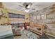 Charming Bedroom with a crib, cozy chair, and decorative wood accent wall at 4617 Gonzales Dr, Las Vegas, NV 89130