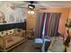 A charming Bedroom with an animal-themed wallpaper, a crib and a cozy sitting area at 4617 Gonzales Dr, Las Vegas, NV 89130