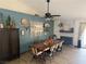 Dining room boasts a stunning accent wall, fireplace, and a rustic wood dining table at 4617 Gonzales Dr, Las Vegas, NV 89130