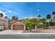Inviting single-story home with desert landscaping, a two-car garage, and mature shade trees at 4617 Gonzales Dr, Las Vegas, NV 89130