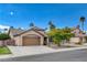 Attractive single-story home with desert landscaping, a two-car garage, and a well-kept lawn at 4617 Gonzales Dr, Las Vegas, NV 89130