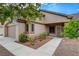 A single story home featuring desert landscaping, a two car garage and a tiled roof at 4617 Gonzales Dr, Las Vegas, NV 89130