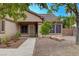 A single story home featuring desert landscaping, a tiled roof, and mature trees at 4617 Gonzales Dr, Las Vegas, NV 89130