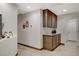 Hallway with built-in cabinets, granite countertops, and access to other rooms in the home at 4617 Gonzales Dr, Las Vegas, NV 89130