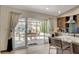 Bright kitchen with an island, stainless appliances, and a view of the outdoor patio and dining area at 4617 Gonzales Dr, Las Vegas, NV 89130