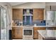 Stylish kitchen features granite countertops, blue backsplash, and stainless steel appliances at 4617 Gonzales Dr, Las Vegas, NV 89130