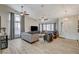 Bright living room with hardwood floors, ceiling fans, neutral paint, and plush furniture at 4617 Gonzales Dr, Las Vegas, NV 89130