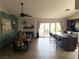 Open-concept living area with a dining table, fireplace, kitchen, and outdoor access at 4617 Gonzales Dr, Las Vegas, NV 89130