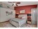 Comfortable bedroom featuring a ceiling fan, stylish rug, and a cozy queen-size bed at 4617 Gonzales Dr, Las Vegas, NV 89130