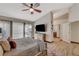 Comfortable main bedroom with a large bed, wooden dresser, and access to an ensuite bathroom at 4617 Gonzales Dr, Las Vegas, NV 89130