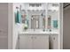 Bathroom with modern vanity, shower-tub combo, and decorative mirror above the sink at 4855 S Torrey Pines Dr # 101, Las Vegas, NV 89103