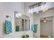 Bathroom with modern vanity, shower-tub combo, and decorative mirror above the sink at 4855 S Torrey Pines Dr # 101, Las Vegas, NV 89103