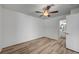 Minimalist bedroom featuring light wood floors and a ceiling fan at 4855 S Torrey Pines Dr # 101, Las Vegas, NV 89103