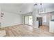 Open-concept living area with light wood floors, leading to a modern kitchen at 4855 S Torrey Pines Dr # 101, Las Vegas, NV 89103
