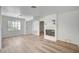 Spacious living room with a fireplace and light wood floors at 4855 S Torrey Pines Dr # 101, Las Vegas, NV 89103