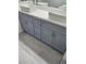 Bathroom vanity with double vessel sinks and storage in shaker-style cabinets at 5155 W Tropicana Ave # 2089, Las Vegas, NV 89103