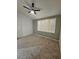 Bedroom showcasing carpet, ceiling fan, and shuttered window at 5155 W Tropicana Ave # 2089, Las Vegas, NV 89103