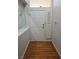 The entryway features hardwood floors, a white door, and natural light at 5155 W Tropicana Ave # 2089, Las Vegas, NV 89103