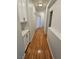 Upstairs hallway with hardwood flooring and cabinetry with countertops at 5155 W Tropicana Ave # 2089, Las Vegas, NV 89103