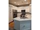 Bright kitchen features white cabinets, stainless steel appliances, and quartz countertops at 5155 W Tropicana Ave # 2089, Las Vegas, NV 89103
