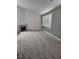 Open-concept living area featuring a fireplace and a sliding glass door at 5155 W Tropicana Ave # 2089, Las Vegas, NV 89103
