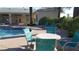 A refreshing pool area with chairs and tables at 5155 W Tropicana Ave # 2089, Las Vegas, NV 89103