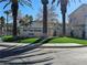 Community signage in front of the West Trop Condos with lush landscaping at 5155 W Tropicana Ave # 2089, Las Vegas, NV 89103