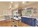 Charming kitchen and dining area with granite counters, wood floors, and ample natural light at 5222 Joshua Jose St, North Las Vegas, NV 89031