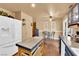 Spacious kitchen with island, stainless steel refrigerator, and adjacent dining area at 5222 Joshua Jose St, North Las Vegas, NV 89031