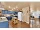 Kitchen featuring blue cabinets, stainless appliances, and an island with butcher block top at 5222 Joshua Jose St, North Las Vegas, NV 89031
