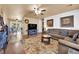 Inviting living room with hardwood floors, neutral paint, and a cozy seating area at 5222 Joshua Jose St, North Las Vegas, NV 89031