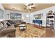 Bright living room featuring a ceiling fan, hardwood floors, and comfortable seating at 5222 Joshua Jose St, North Las Vegas, NV 89031