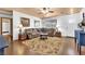 Comfortable living room with hardwood floors, area rug, and a cozy seating arrangement at 5222 Joshua Jose St, North Las Vegas, NV 89031