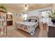 Cozy main bedroom with ceiling fan, patterned bedding, and neutral color scheme at 5222 Joshua Jose St, North Las Vegas, NV 89031