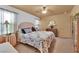 Comfortable main bedroom featuring a ceiling fan, patterned bedspread, and soft, natural light at 5222 Joshua Jose St, North Las Vegas, NV 89031