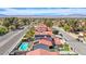 Aerial view of the neighborhood, showcasing tree-lined streets and a backyard pool with patio at 5301 Kalmia Dr, Las Vegas, NV 89103