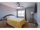 Bright bedroom with wooden floors, ceiling fan and large windows, creating a peaceful retreat at 5301 Kalmia Dr, Las Vegas, NV 89103